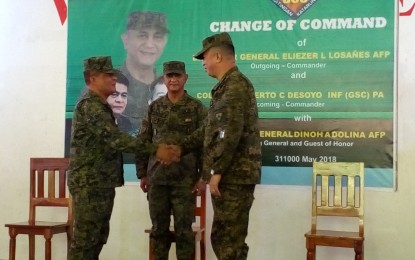 <p><strong>NEW NEGROS ISLAND ARMY COMMANDER. </strong>Brigadier General Dinoh Dolina (center), commander of the 3<sup>rd</sup> Infantry Division, witnesses the turnover of command from Brigadier General Eliezer Losañes (left) to Colonel Alberto Desoyo as head of the 303<sup>rd</sup> Infantry Brigade in rites held at Camp Major Nelson Gerona in Murcia, Negros Occidental on Thursday (May 31, 2018). (<em>Photo by Nanette L. Guadalquiver)</em><em> </em></p>